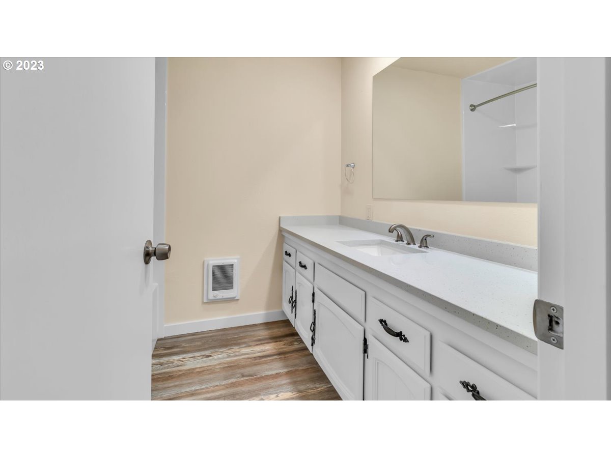 1318 15th Street Oregon City, OR 97045 - Photo 27 of 38 a bathroom with a sink and a mirror