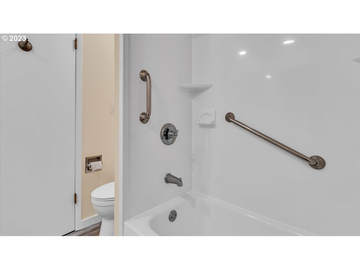 1318 15th Street Oregon City, OR 97045 - Photo 28 of 38 a bathroom with a sink a toilet a shower and a mirror