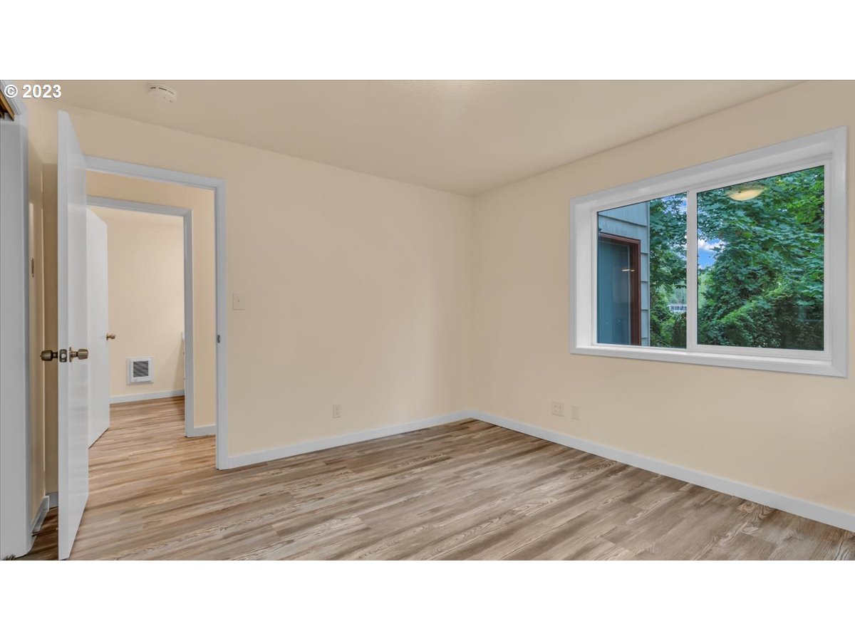 1318 15th Street Oregon City, OR 97045 - Photo 30 of 38 a room with a bed and a window
