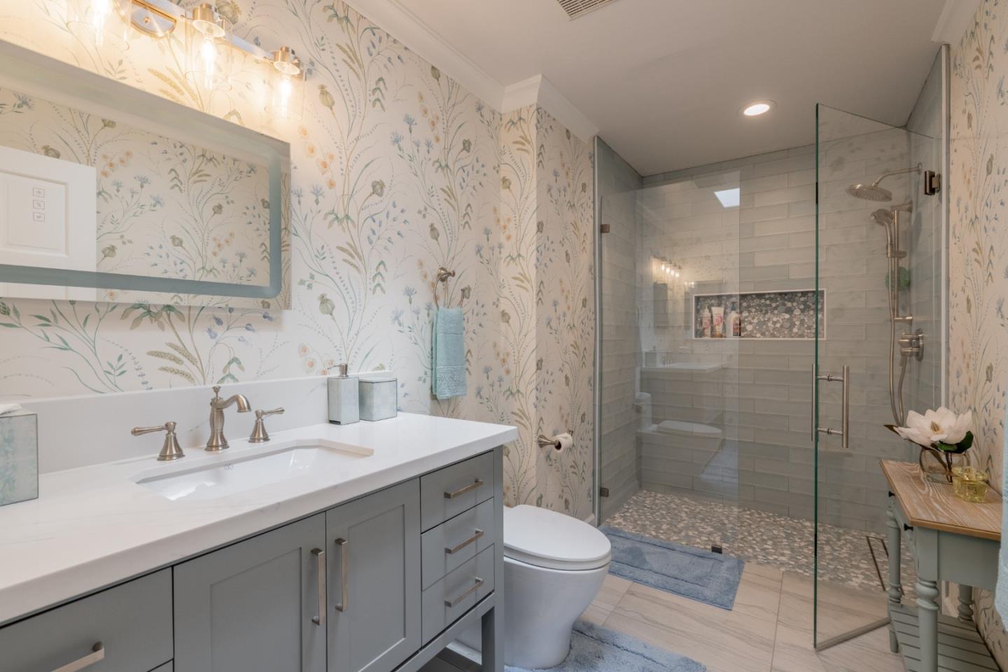 1043 Broncho Road Pebble Beach, CA 93953 - Photo 17 of 21 a bathroom with a sink a toilet and shower