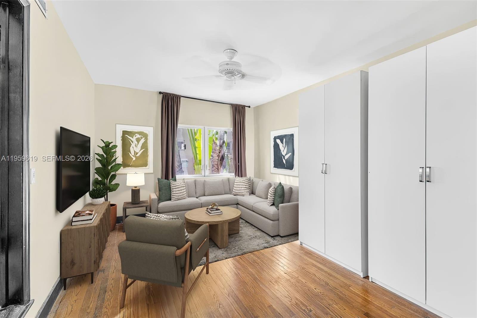 711 14th Street, Unit 4 Miami Beach, FL 33139 - Photo 6 of 27 a living room with furniture and a flat screen tv