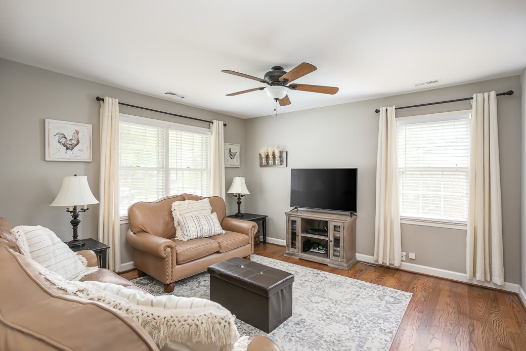 DESIGNER GREY PAINTED Family Room has direct access to Kitchen Dining area that overlooks the HUGE backyard through large windows that flood the home with TONS OF NATURAL LIGHT! The OPEN SPACES are perfect for entertaining! Plenty of room for everyone! Family Room