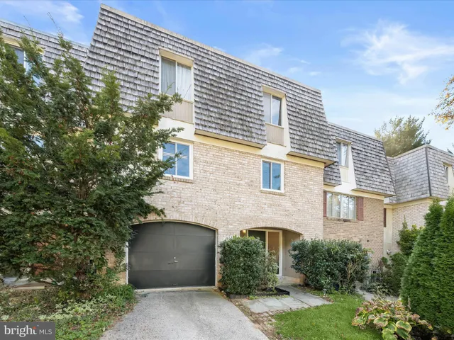 front view of a house with a garden