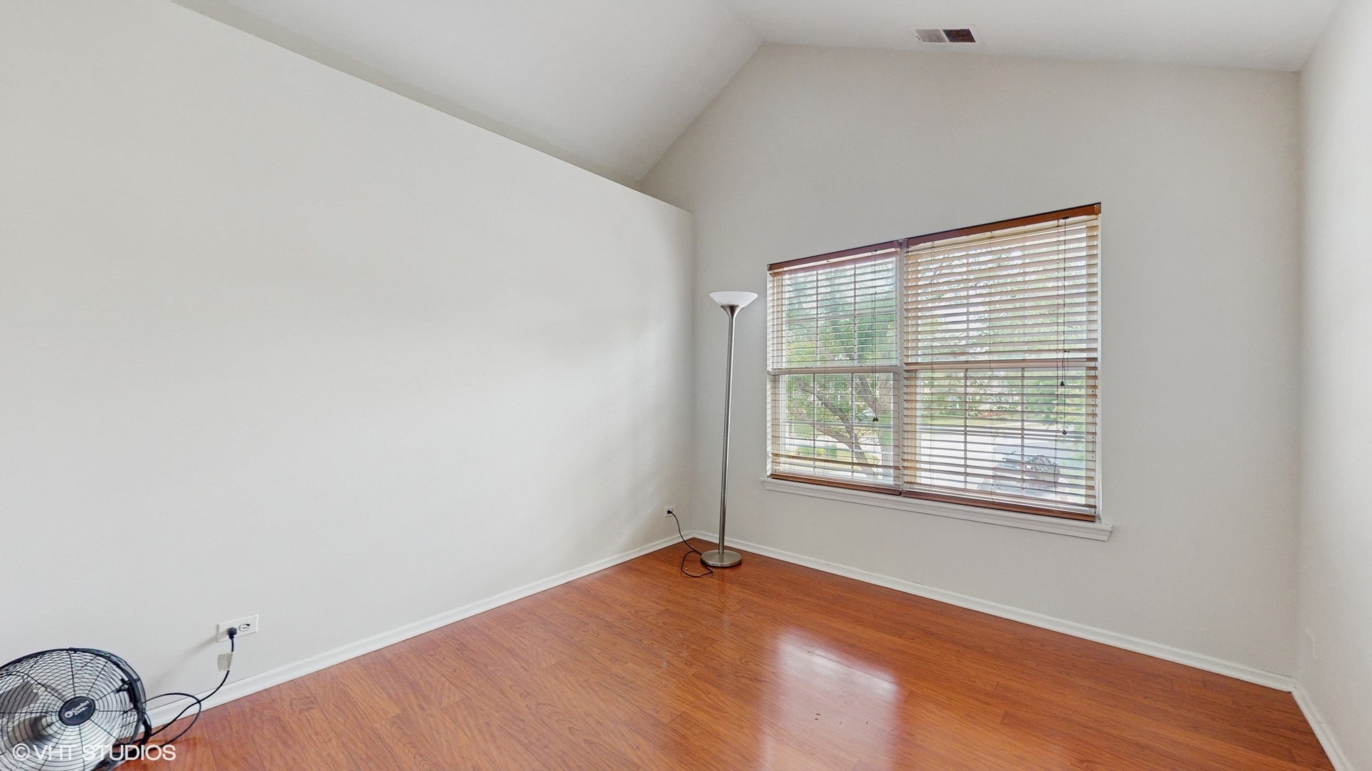 434 Cromwell Circle, Unit 3 Bartlett, IL 60103 - Photo 16 of 25 a view of an empty room with a window
