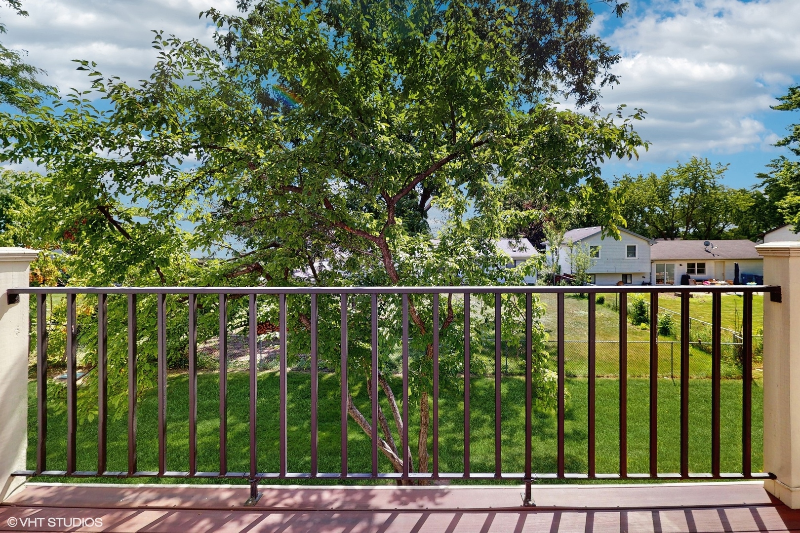 434 Cromwell Circle, Unit 3 Bartlett, IL 60103 - Photo 21 of 25 a view of a balcony with a green space