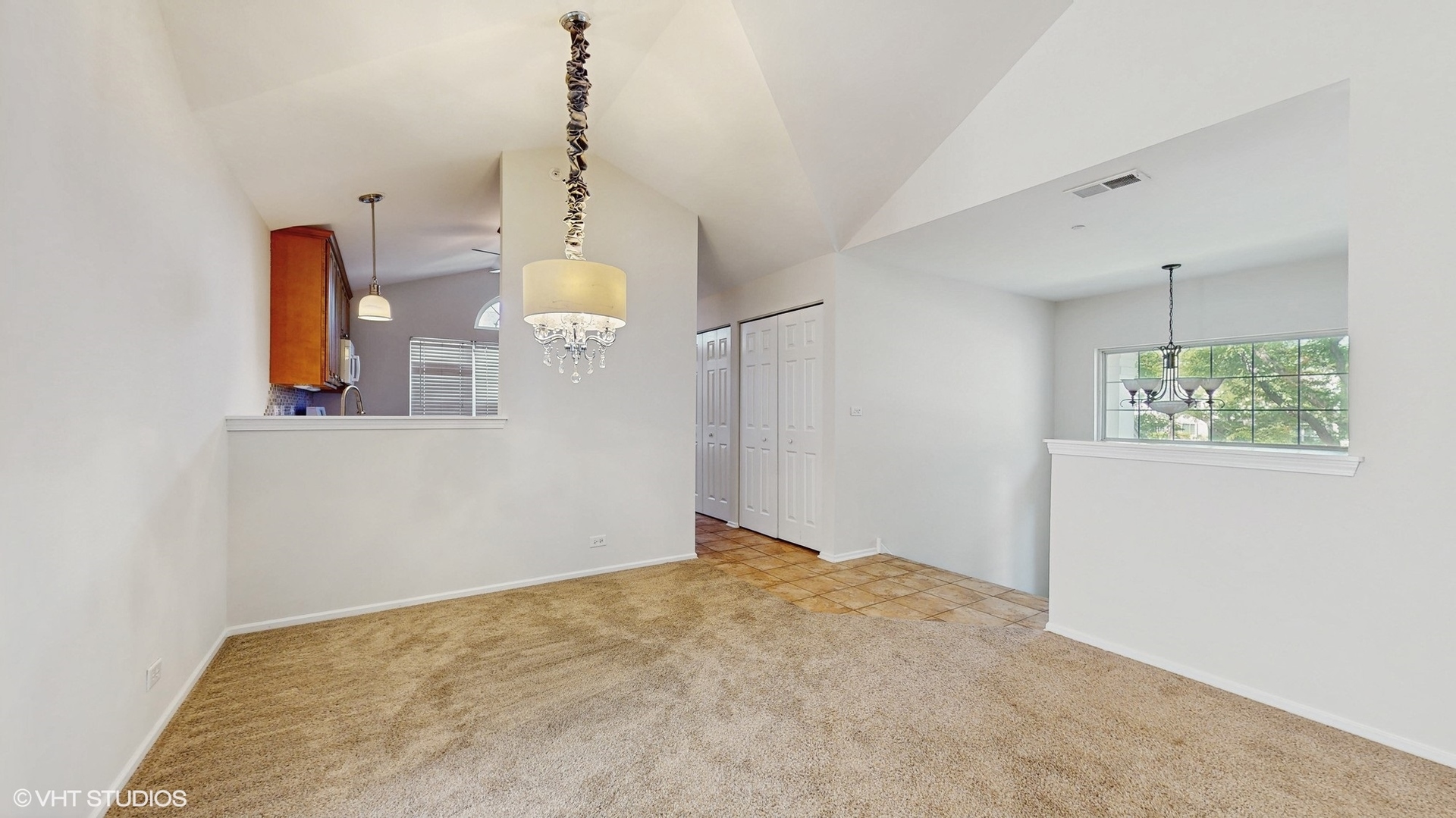 434 Cromwell Circle, Unit 3 Bartlett, IL 60103 - Photo 3 of 25 an empty room with windows and cabinet