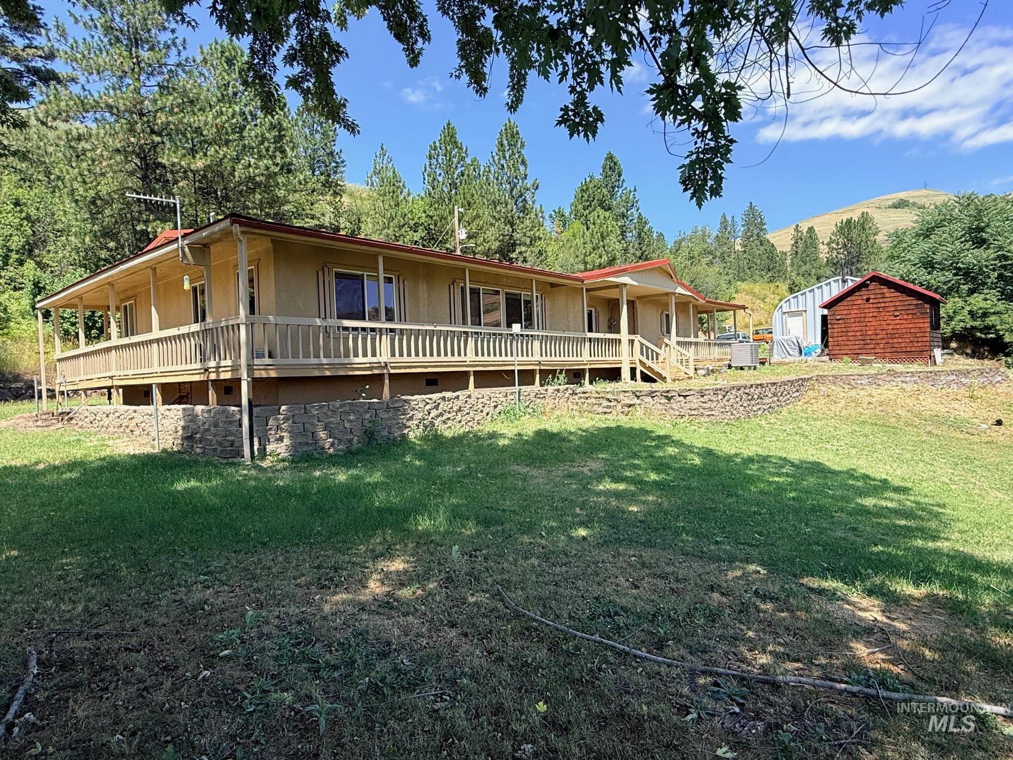 35322 River Road Lenore, ID 83541 - Photo 38 of 42 Ranch-style residence featuring a full-length covered porch with wood railing and stairs