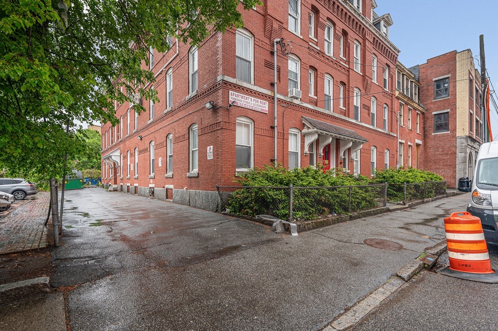90 Appleton Street, Unit U:7 Lowell, MA 01852 - Photo 2 of 13 a view of a building with a street