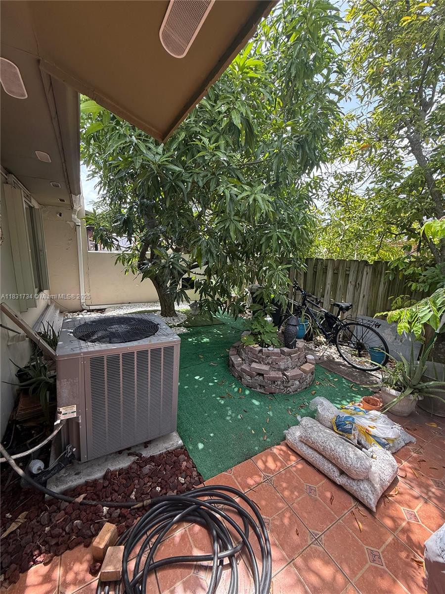 12246 Southwest 116th Lane Miami, FL 33186 - Photo 13 of 23 a view of backyard with swimming pool and outdoor seating