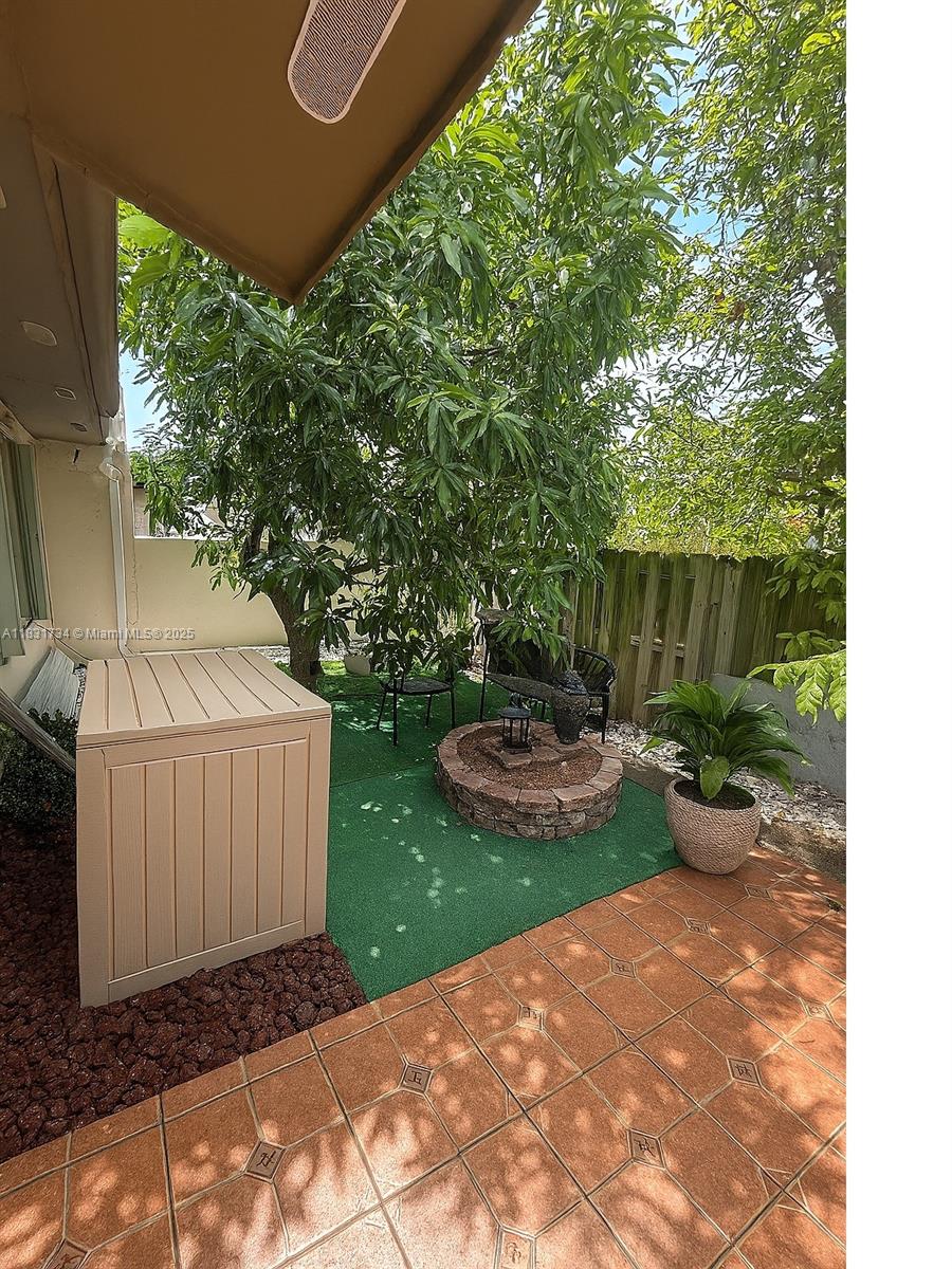 12246 Southwest 116th Lane Miami, FL 33186 - Photo 14 of 23 a view of a backyard with garden and plants