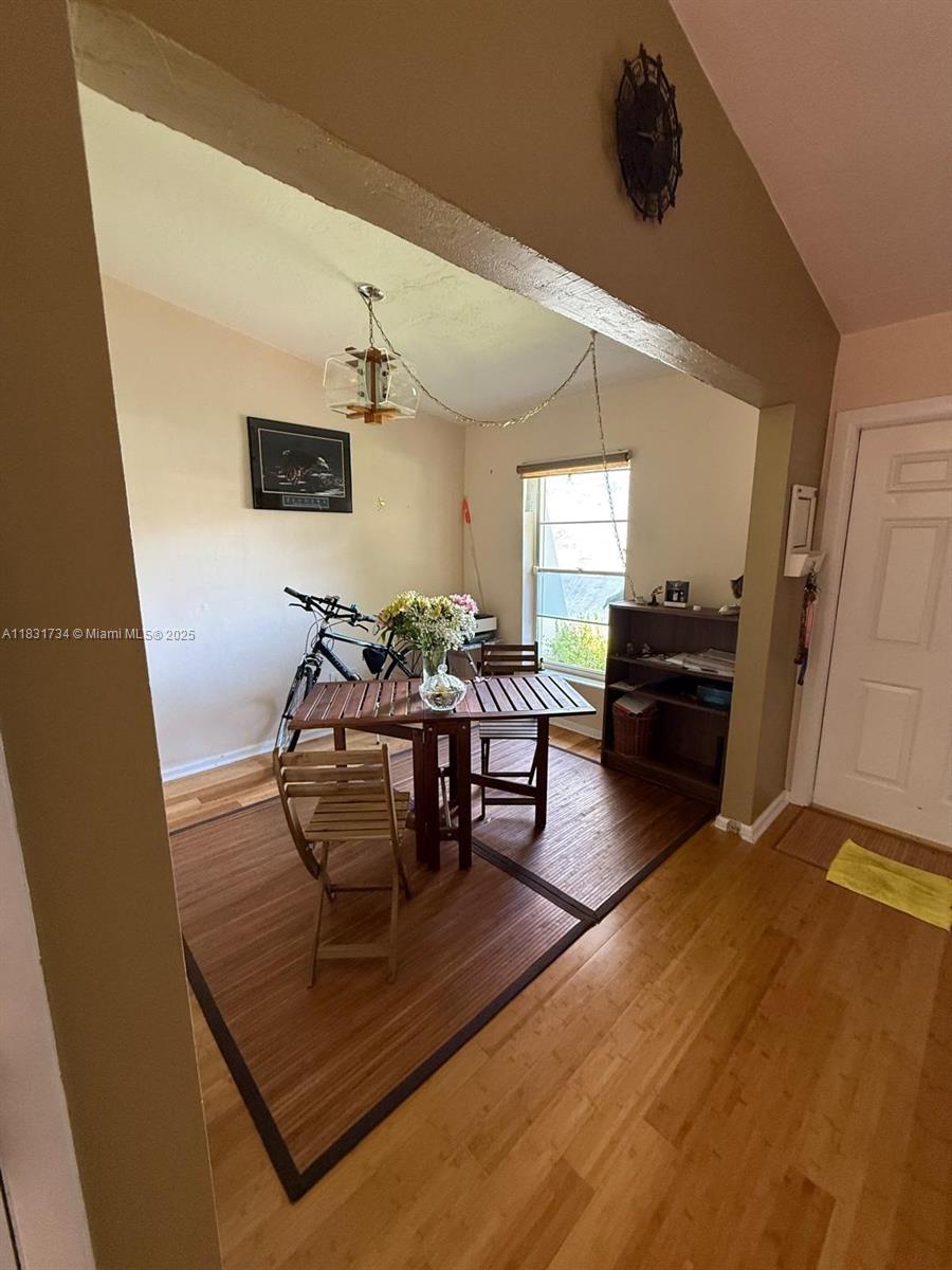12246 Southwest 116th Lane Miami, FL 33186 - Photo 3 of 23 a living room with furniture and wooden floor