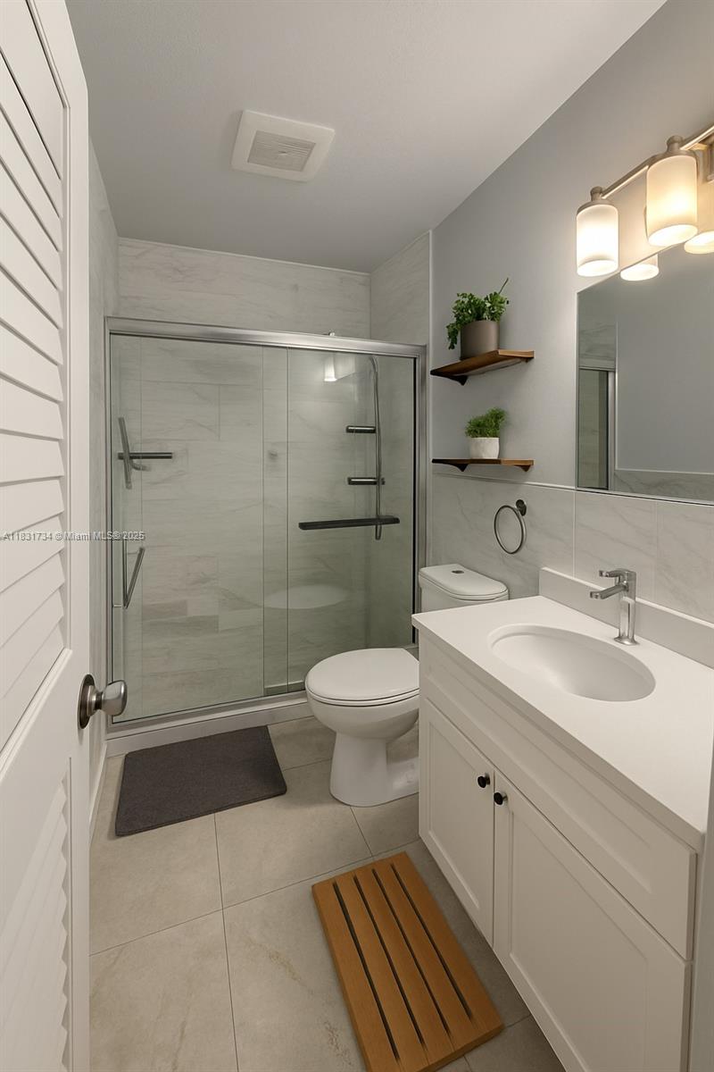 12246 Southwest 116th Lane Miami, FL 33186 - Photo 8 of 23 a bathroom with a sink toilet and shower