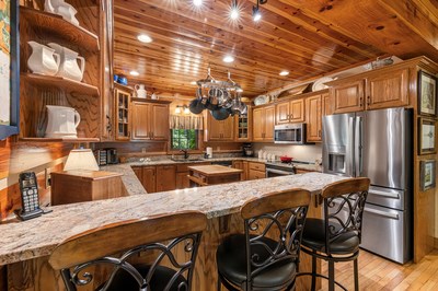 105 Double Branch Trail Murphy, NC 28906 - Photo 18 of 75 a kitchen with stainless steel appliances granite countertop a sink a stove and a refrigerator