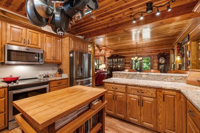 105 Double Branch Trail Murphy, NC 28906 - Photo 19 of 75 a kitchen with stainless steel appliances granite countertop a sink a stove and cabinets