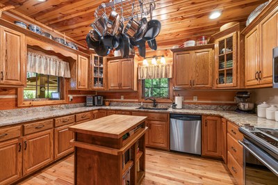 105 Double Branch Trail Murphy, NC 28906 - Photo 20 of 75 a kitchen with stainless steel appliances granite countertop a sink a stove and cabinets