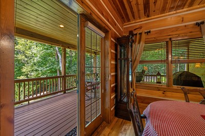 105 Double Branch Trail Murphy, NC 28906 - Photo 26 of 75 a view of a balcony with furniture and wooden floor