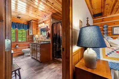 a living room with furniture a rug and a fireplace