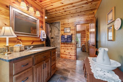 105 Double Branch Trail Murphy, NC 28906 - Photo 44 of 75 a bathroom with a sink and a large mirror