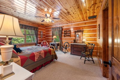 105 Double Branch Trail Murphy, NC 28906 - Photo 47 of 75 a bed room with a bed and a chair