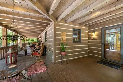 a outdoor living space with furniture and a fireplace