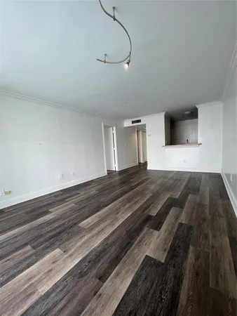 a bedroom with a bed and a night stand