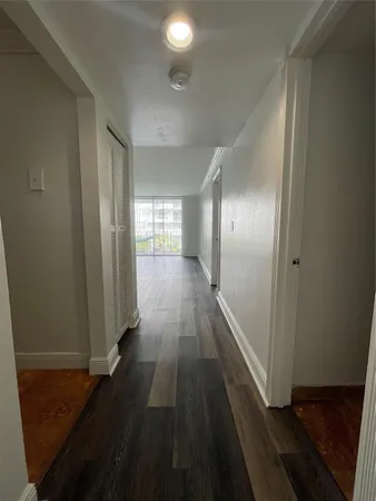 a view of gallery with wooden floor