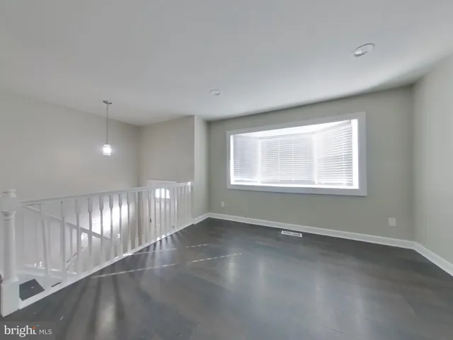 a view of an empty room with windows