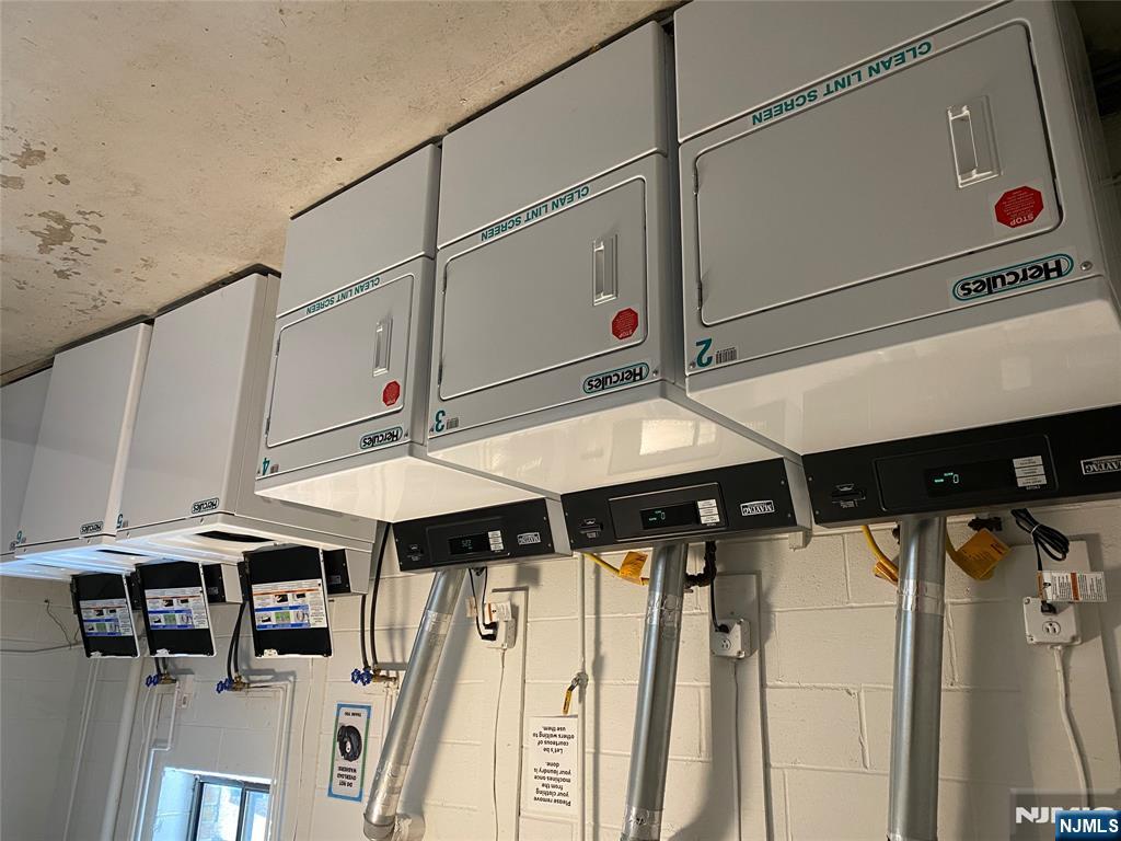 107 Bellgrove Drive, Unit 5A Mahwah, NJ 07430 - Photo 14 of 14 a utility room with dryer and washer