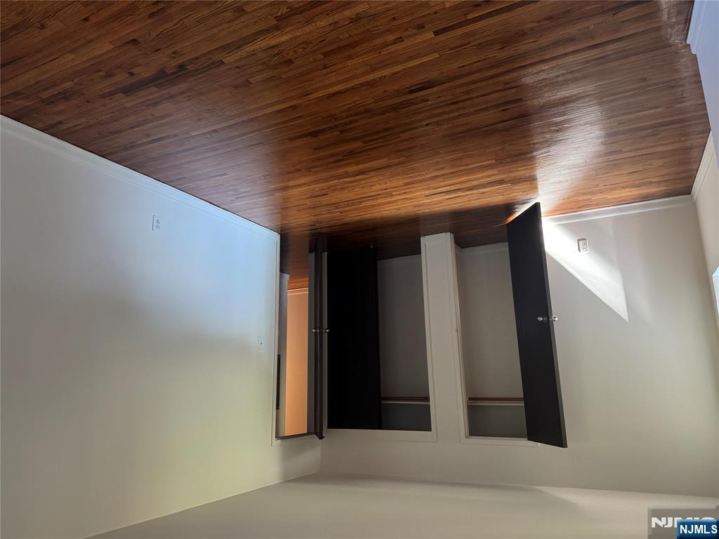 107 Bellgrove Drive, Unit 5A Mahwah, NJ 07430 - Photo 5 of 14 a view of an empty room with wooden floor