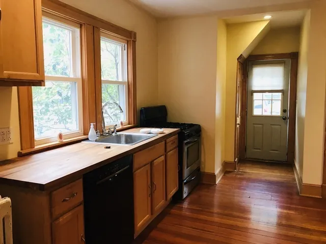 a kitchen with a sink and a window