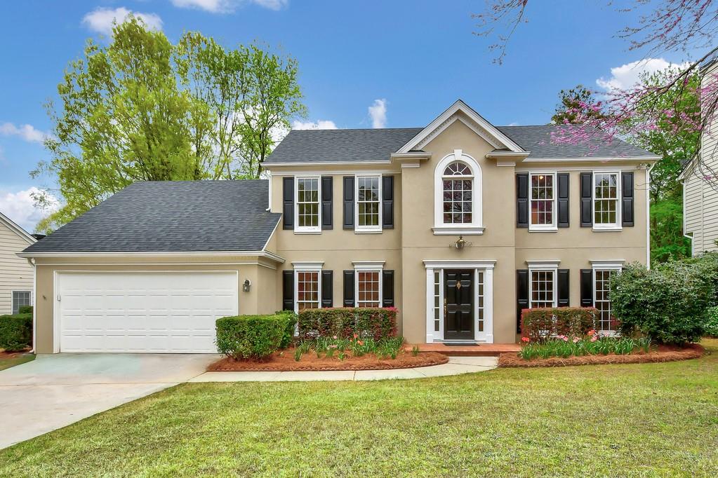 4780 Agate Drive Johns Creek, GA 30022 - Photo 1 of 1 front view of a house with a yard