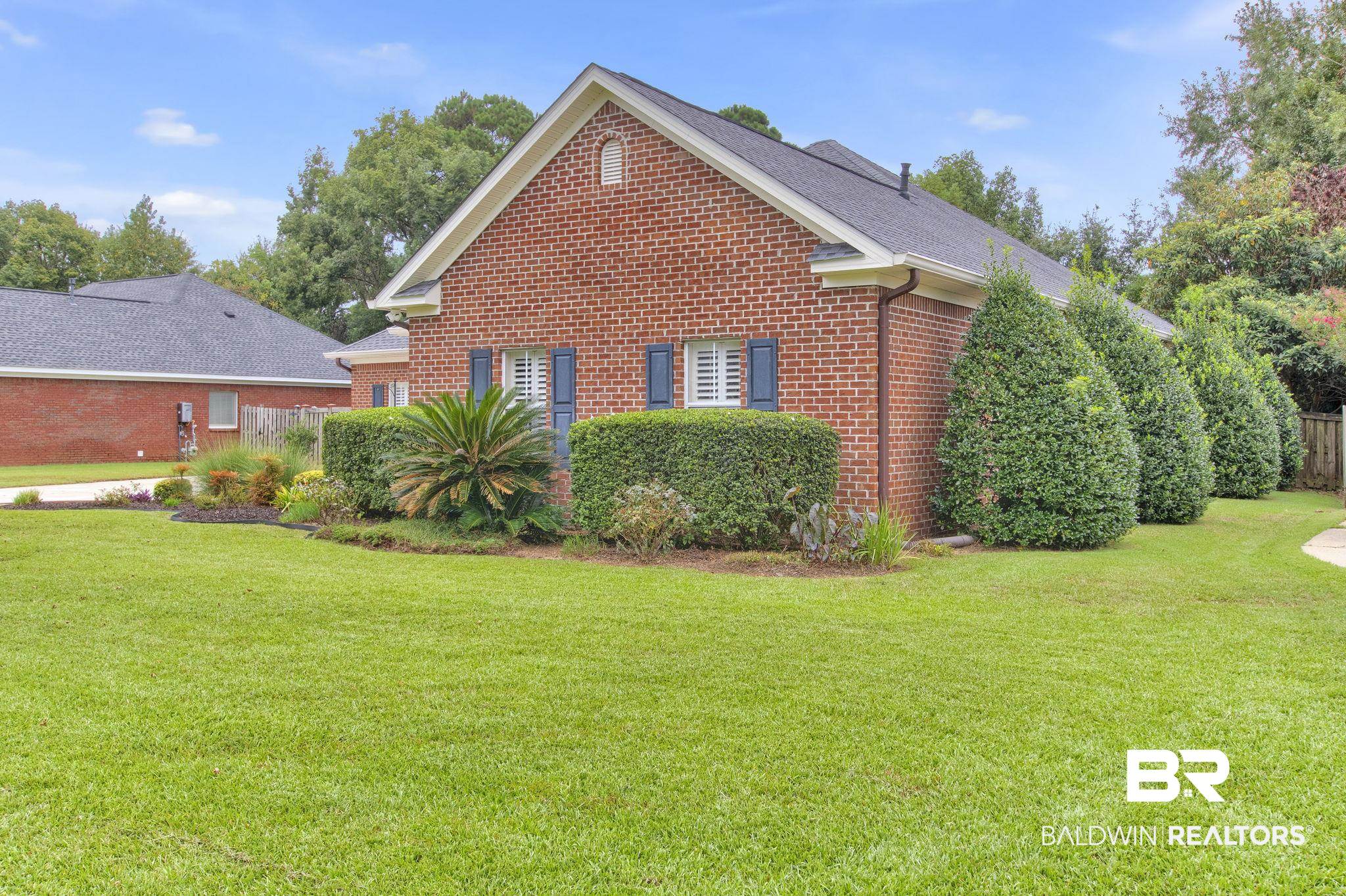 9478 Autauga Bend Daphne, AL 36526 - Photo 5 of 73 View of property exterior featuring a yard