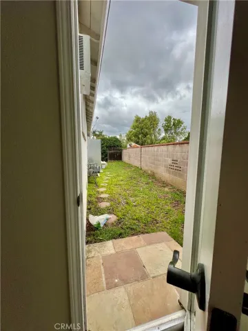 a wooden bench sitting in front of a house