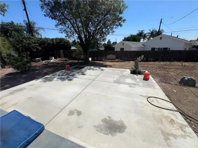 a front view of house with yard and trees