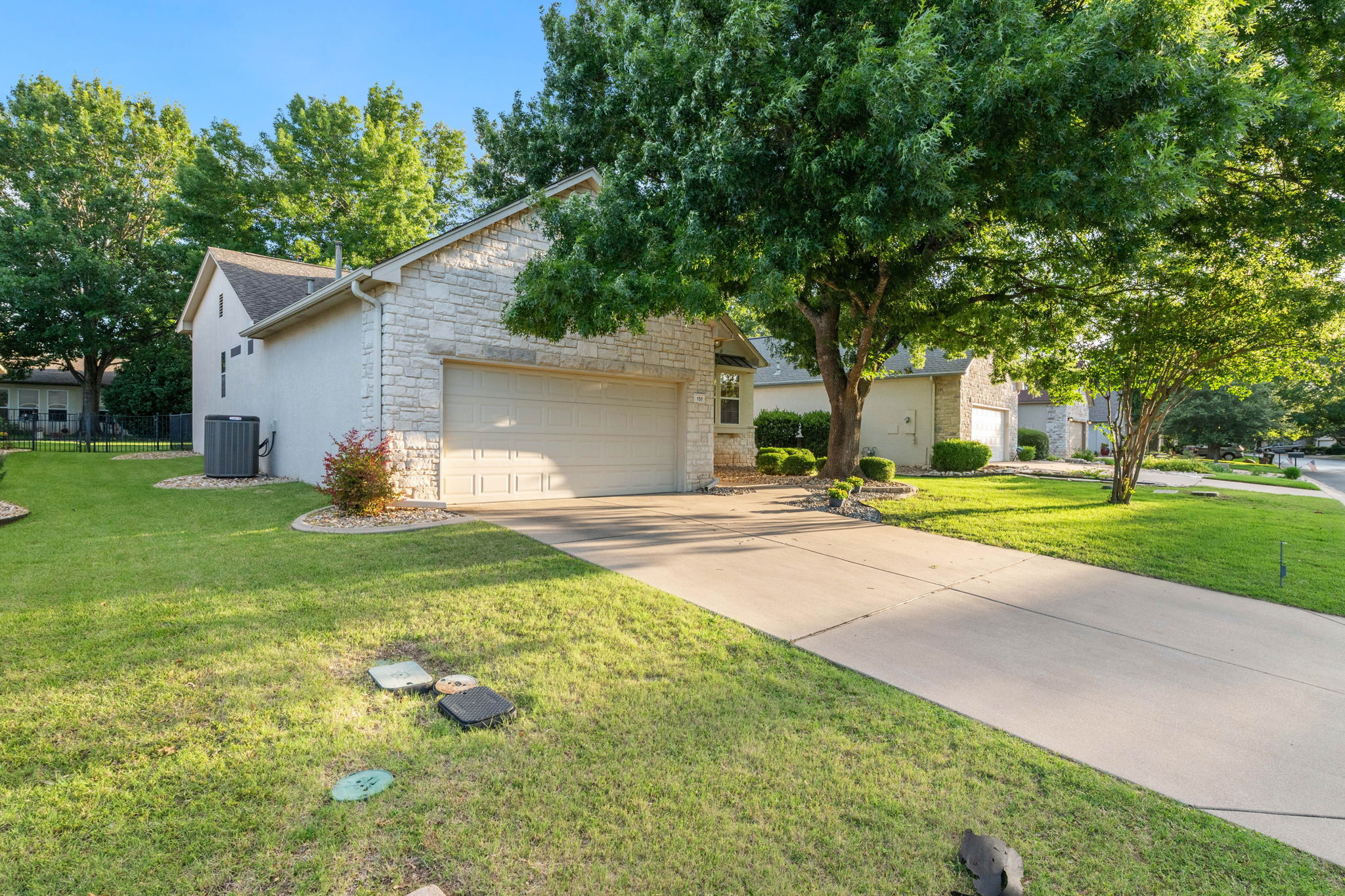 137 Trail Rider Way Georgetown, TX 78633 - Photo 27 of 29 A classic stone facade and inviting driveway welcome you to this charming suburban residence.