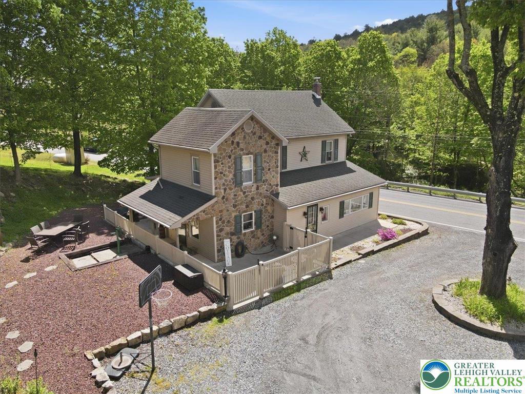 4880 Little Gap Road Kunkletown, PA 18058 - Photo 67 of 100 This inviting home offers charming stone and siding construction, surrounded by lush trees and a convenient driveway.