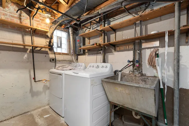 a utility room with a sink a washer and dryer