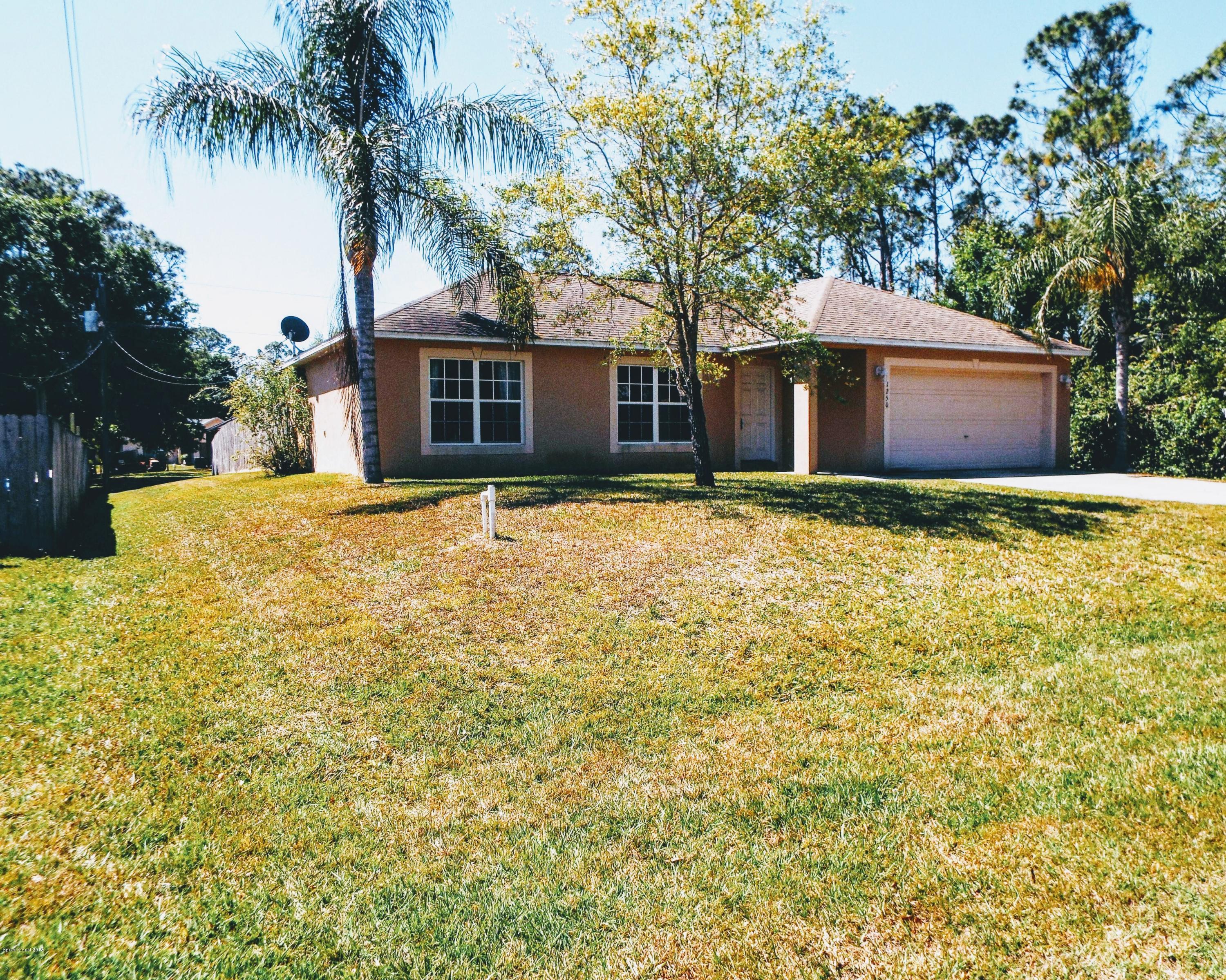1250 Rainbow Road Southeast Palm Bay, FL 32909 - Photo 1 of 20 Front of Home