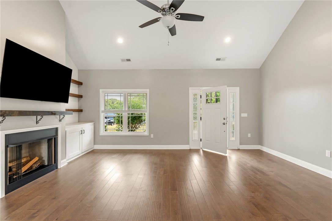 1411 Dunn Road Anderson, SC 29625 - Photo 7 of 30 This inviting living area boasts rich hardwood floors and abundant natural light.