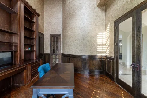 a living room with furniture a rug and a window