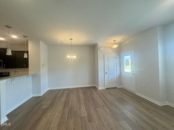 a kitchen with granite countertop stainless steel appliances and wooden cabinets