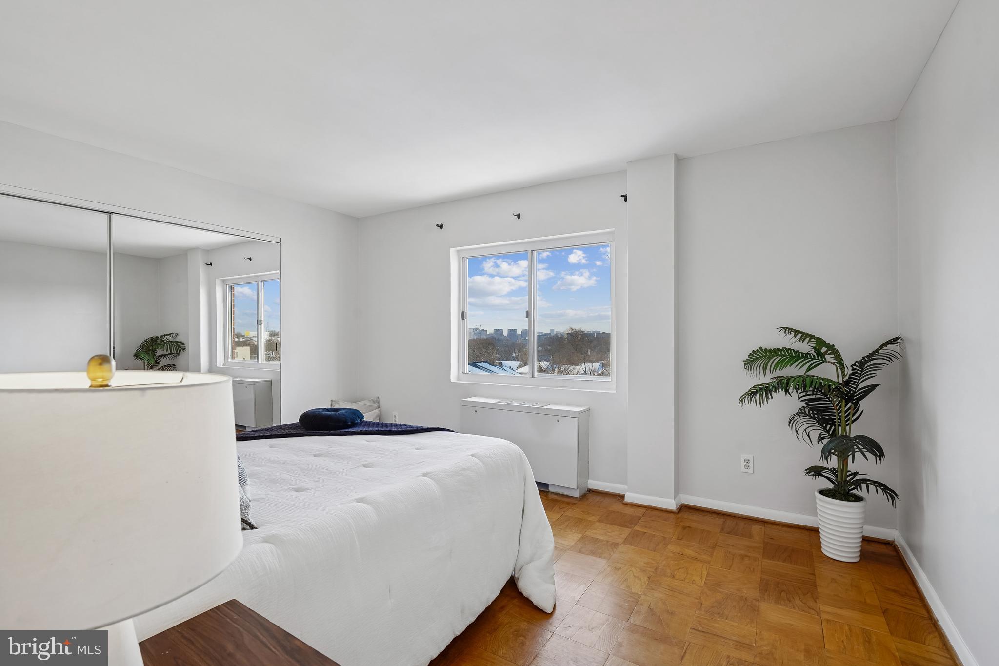 4343 Cherry Hill Road, Unit 705 Arlington, VA 22207 - Photo 17 of 38 a bedroom with a bed and a potted plant