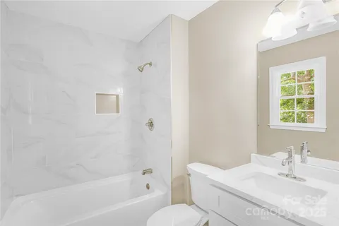 a bathroom with a sink toilet and bathtub