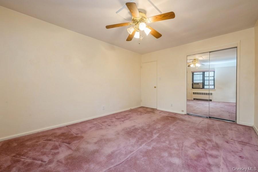 73-21 220th Street, Unit 139B2 Queens, NY 11364 - Photo 15 of 35 an empty room with fan and entrance