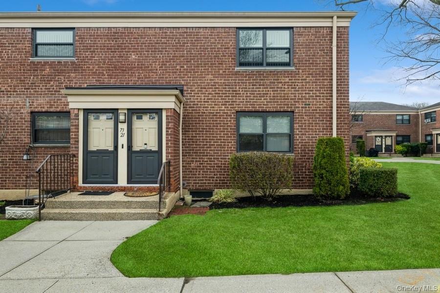 73-21 220th Street, Unit 139B2 Queens, NY 11364 - Photo 2 of 35 a front view of a house with a garden