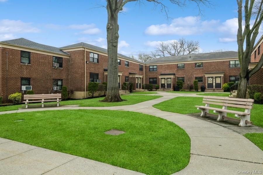 73-21 220th Street, Unit 139B2 Queens, NY 11364 - Photo 21 of 35 a view of a building with a yard