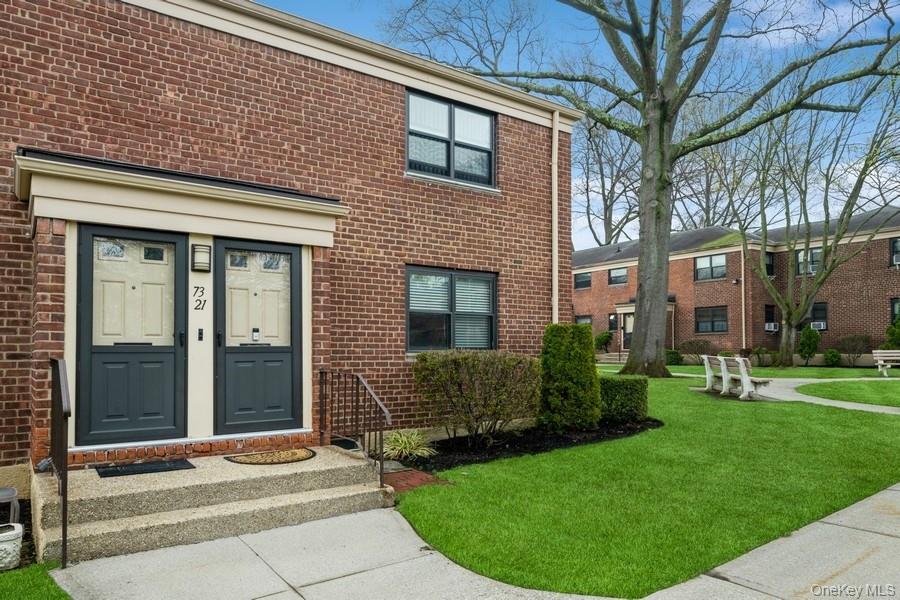 73-21 220th Street, Unit 139B2 Queens, NY 11364 - Photo 23 of 35 a view of a house with a garden
