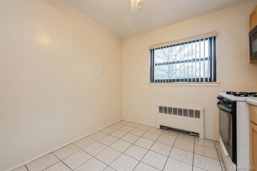 73-21 220th Street, Unit 139B2 Queens, NY 11364 - Photo 28 of 35 a view of a livingroom with an empty space and a window