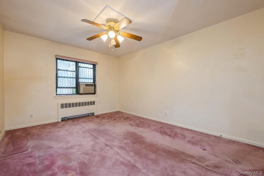 73-21 220th Street, Unit 139B2 Queens, NY 11364 - Photo 33 of 35 an empty room with windows