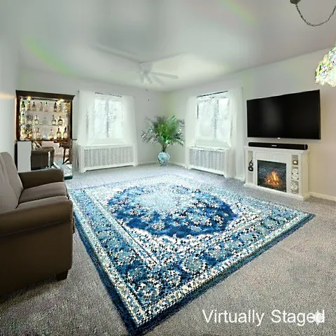 a living room with a couch a window and a flat screen tv